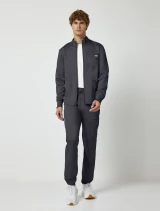 Full-length model view of Cherokee Workwear Revolution Men's Zip Front Warm-Up Scrub Jacket WW320 in Pewter