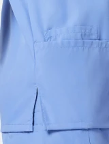 Patch pocket and side vent detail of Cherokee Workwear Originals Women's Dolman Sleeve V-Neck Scrub Top 4700 in Ciel