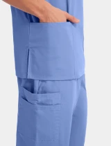 Patch pocket and side vent detail of Cherokee Workwear Originals Unisex 3 Pocket V-Neck Scrub Top 4876 in Ciel