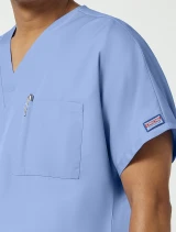 Chest pocket detail of Cherokee Workwear Originals Unisex Tuckable V-Neck Scrub Top 4777 in Ciel