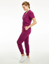 Full side view of the Spirit Scrubs Tuck-In Top PWT113 in wine.