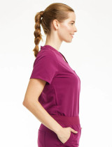 Right side view of the Spirit Scrubs Tuck-In Top PWT113 in wine.