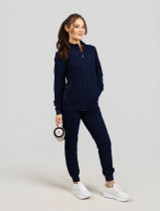 Full model view of the Spirit Scrubs women's zip-front scrub jacket UOJ709 in navy.