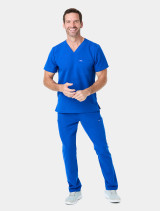 Full body view of the Spirit Scrubs men's V-neck medical scrub top in royal #UOT333 untucked with the scrub pant #UOB609 in royal.