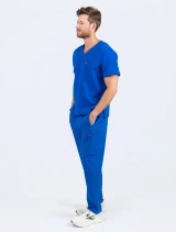 Man wearing the Spirit Scrubs straight leg pants UOB409 and V-neck top UOT333 in royal.