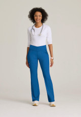 Full model view of the Grey's Anatomy Knit-Stretch women's flare-leg scrub pant GRSP684 in royal.