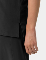 Zoomed in view of the side slit on the  women's Carhartt crew neck scrub top C13610 in black