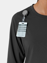 Zoomed in view of the badge reel holder on the  Carhartt crew neck scrub top C13610 in black