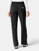 Back side view of a female healthcare worker wearing the women's Carhartt boot cut scrub pant c53310 in black