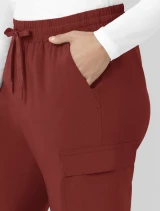 A close up view of the left pocket on the  Carhartt womens ankle length scrub pant C53410 in amber terrain