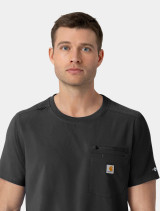A close up view of the crew neck on the Carhartt mens scrub top C16510 in black