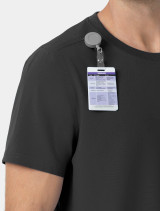A close up view of the badge reel holder on the Carhartt mens scrub top C16510 in black