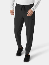 Front view from the waist down of a healthcare worker wearing the Carhartt mens scrub pant C56310 in black