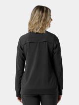 The back of a healthcare worker wearing the Carhartt womens scrub jacket C82410 in black