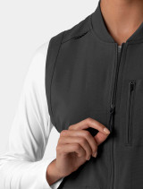 A close up view of the front zipper on the  Carhartt womens scrub vest C82510 in black