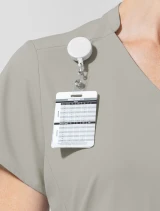 V-neck and badge loop close-up of WINK Aura Women's 2-Pocket V-Neck Scrub Top 6270 in Cool Gray