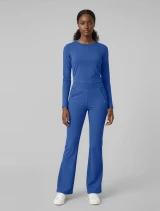 Full-length model view of Med Couture Insight Women's High-Rise Flare Leg Scrub Pant MC00078 in Royal