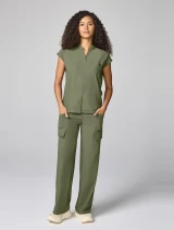 Full-length model view of Healing Hands Quest Women's Mandarin Collar Scrub Top HH757 in Olive