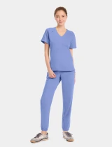 Full-length model view of Cherokee Workwear Originals Ultra Women's Tuckable V-Neck Scrub Top CK954A in Ciel