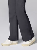 Flare hem and side vent detail of Cherokee Workwear Revolution Women's Mid Rise Flare Cargo Scrub Pant CK00039 in Pewter