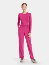 Full-length model view of Med Couture Amp Women's Straight Leg Pull-On Scrub Pant MC103 in Pink Power