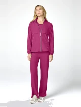 Full-length model view of Med Couture Amp Women's Warm Up Scrub Jacket MC00028 in Pink Power