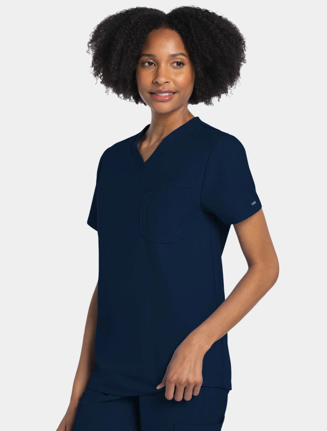 Front view of the Workwear Originals Ultra unisex scrub top #CK778A in navy.