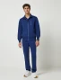 Full-length model view of Healing Hands Purple Label Men's Jonathan Bomber Scrub Jacket 5530 in Navy