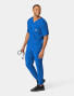 A top and pant full body view of a healthcare worker wearing the Carhartt mens scrub top C16110 in royal