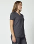 Right side view of Cherokee Workwear Revolution Women's Mock Wrap Scrub Top WW610 in Pewter