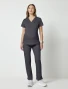 Full-length model view of Cherokee Workwear Revolution Women's Maternity Mock Wrap Scrub Top WW688 in Pewter