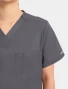 Chest pocket detail of Cherokee Workwear Revolution Unisex V-Neck Scrub Top WW625 in Pewter