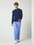 Full-length model view of Cherokee Workwear Professionals Men's Underscrub Knit Top #WW700 in Navy