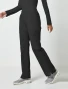 Side view of Cherokee Workwear Professionals Women's Mid Rise Pull-On Cargo Pant #WW170 in Black