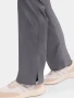 Side vent hem detail of Cherokee Workwear Revolution Women's Mid Rise Flare Drawstring Cargo Scrub Pant WW120 in Pewter