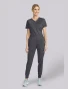 Full-length model view of Cherokee Workwear Revolution Women's Pull-On Drawstring Cargo Jogger Scrub Pant WW115 in Pewter