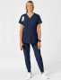 Full body view of the women's Wink W123 maternity scrub top #4555 in navy.