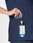 Right pocket view of the women's Wink W123 maternity scrub top #4555 in navy.