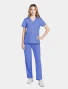 Full-length model view of Cherokee Workwear Originals Ultra Women's 2 Pocket V-Neck Scrub Top CK953A in Ciel