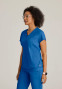 Side view of the Grey's Anatomy Knit-Stretch women's banded bottom scrub top GRST250 in royal.