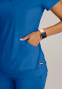 Pocket view of the Grey's Anatomy Knit-Stretch women's banded bottom scrub top GRST250 in royal.
