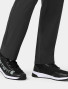 A close up view of the leg opening and cuff on the  Carhartt mens straight leg pant C56410 in black