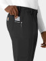 A close up view of the right pocket on the  Carhartt mens straight leg pant C56410 in black