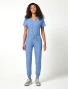 Full-length model view of Cherokee Workwear Originals Ultra Women's Drawstring Jogger Scrub Pant CK00034A in Ciel