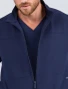 Zoomed in view of the collar and front zipper of the Spirit Scrubs men's scrub jacket in navy blue (Style #UOJ809)
