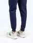 Close up view of the leg cuffs on the Spirit Scrubs men's jogger scrub pant in navy blue (style #UOB607).