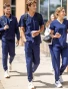 Group of medical students wearing Spirit Scrubs in navy blue.
