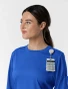 Side profile view with badge loop of WINK Boundless Women's Crew Neck Classic Long Sleeve Scrub Tee 6551 in Royal