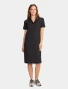 Full-length model view of Cherokee Workwear Originals Ultra Women's Button Front Scrub Dress CK512A in Black