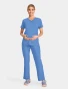 Full-length model view of Cherokee Workwear Originals Ultra Women's Maternity Mock Wrap Scrub Top CK701A in Ciel